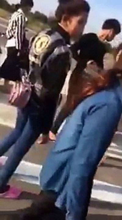 cambodian girl student fighting on the road. 2015