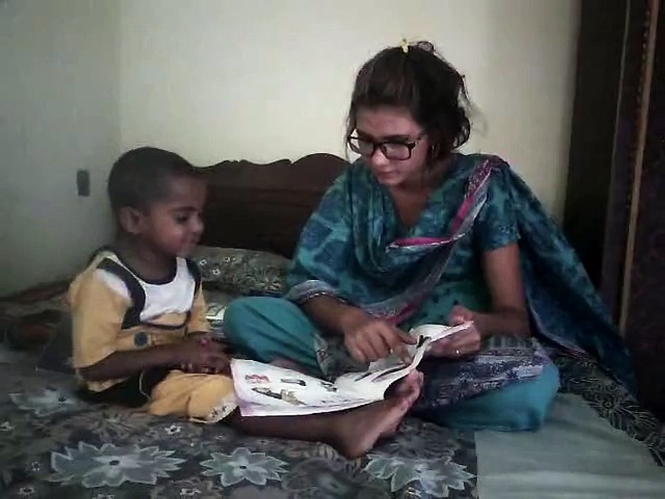 My Wife is teaching this Little Angel ..