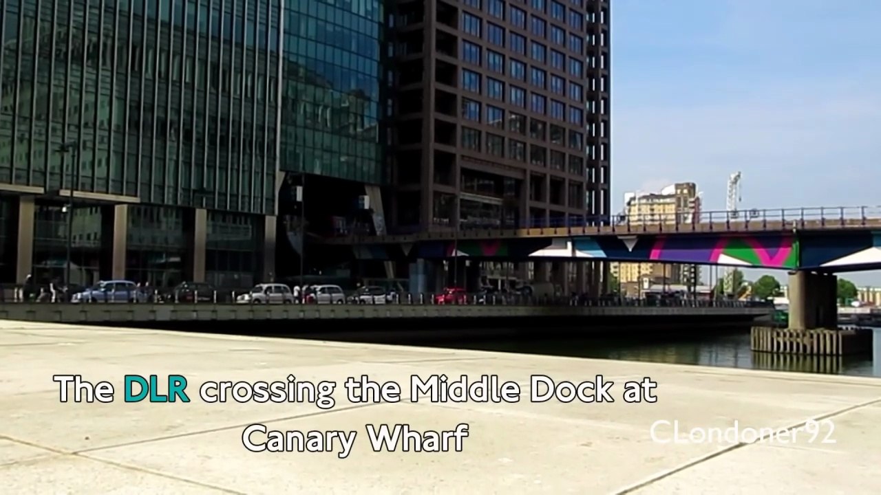 DLR train crossing Middle Dock at Canary Wharf East London