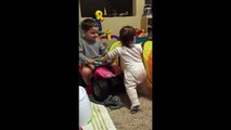 Toddler Helping His Baby Sister Walk Is The Cutest