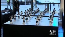 Watch 100 mini robots perform a synchronized dance