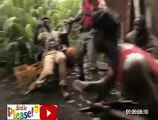 Ape hands a AK47 with African soldiers