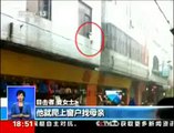 Man Catches Child Who Fell From Second Story Window In China