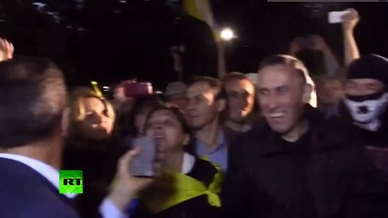 RAW: Mob forces Ukraine MP to throw stone at Russian embassy, spray paint him