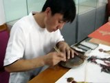 Mr. Li making leather shadow puppets at Mentougou Museum near Beijing (2007)