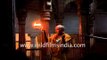 Hindu priest performs aarti at a temple in Varanasi