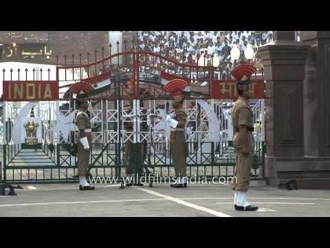 Indian and Pakistani guards march as they take part in the flag off ceremony - Wagah