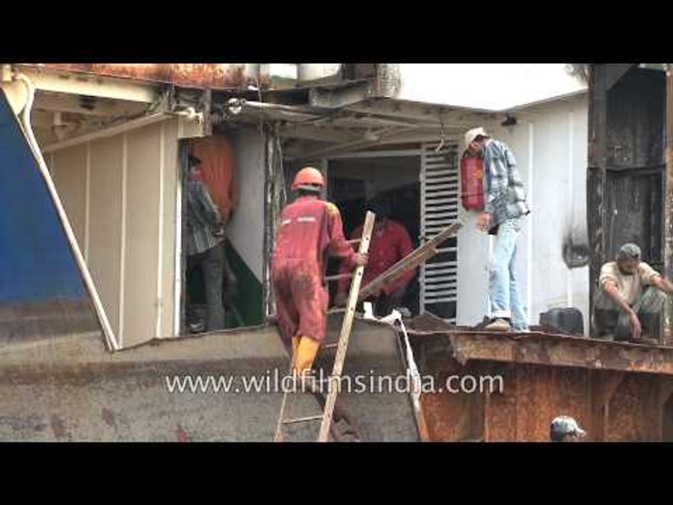 Heavy burden: Ill-protected workers break ships at Alang