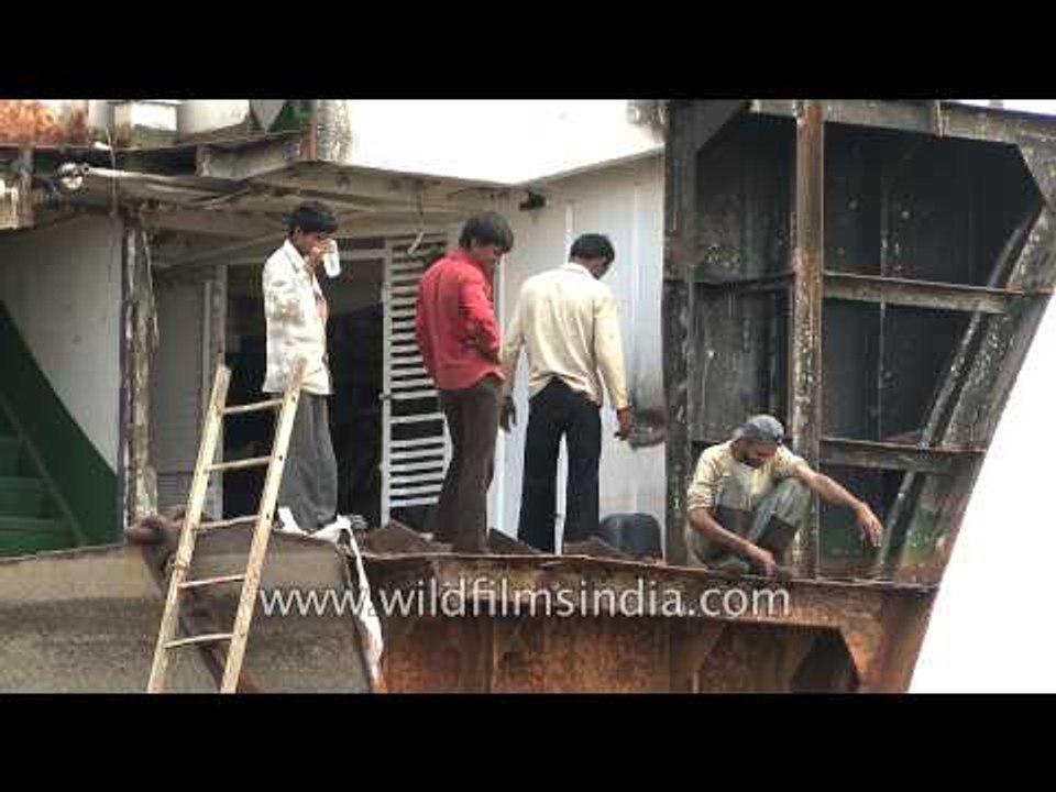Scrap business: Workers at Alang ship-breaking yard, Gujarat