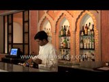 Man prepares a soft drink at Samode Haveli - Rajasthan