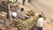 Man sells coconut water at a market in Gujarat