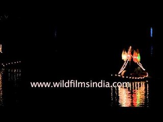 Boats lit up on Hamirsar Lake during Rann Utsav in Gujarat