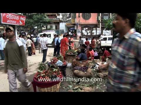 Nepali women selling lychees at a local market in Kathmandu city