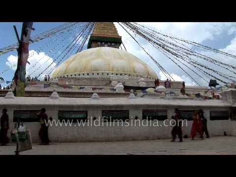 Buddhist prayer flags at Bouddhanath Stupa blowing in the wind
