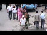 Mother crossing road with child: Kathmandu, Nepal