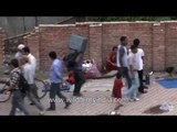 Street vendors sell clothes on a roadside in Kathmandu city