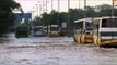 Vehicles wade the water logged roads following heavy rains in Delhi