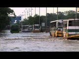 Vehicles wade the water logged roads following heavy rains in Delhi