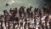 Naga Sadhus or naked Hindu Holy men bathe on the banks of the Ganges river