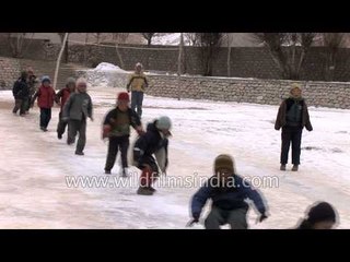Ladakhi children playing in snow - Ladakh