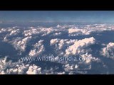 Foot hills and high mountains of the Himalaya swathed in monsoon clouds