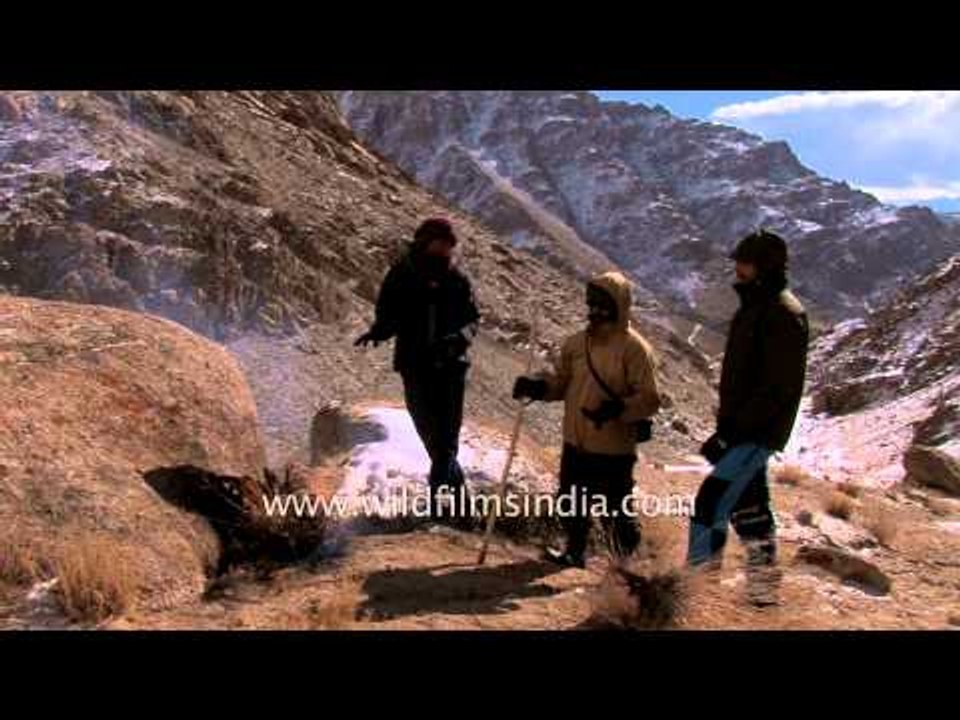 Naturalists make fire to keep themselves warm in snowy mountains of Ladakh