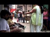 Hijras dancing on a street in Delhi