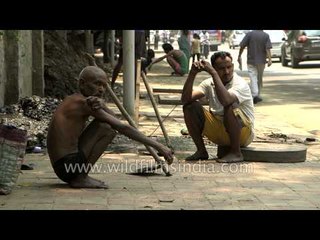 Workers engaged in cleaning sewer lines in Delhi