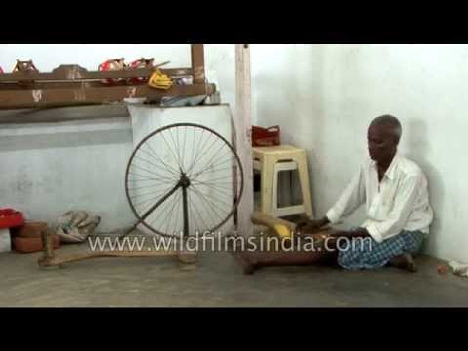 Spinning silk thread to make a saree in India