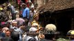 Residents look at collapsed houses in Bhaktapur, Nepal