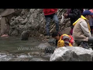 Uttarakhandi devotees gather on the banks of Yamunotri