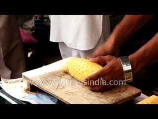 Man sells pineapple slices on street - Gujarat