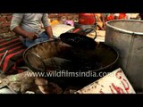 Women kneading wheat dough to make puri in Aligarh