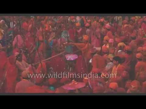 Hindu devotees smear in colours during lathmaar Holi in Barsana