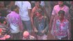 The priest throws colours at participants during Holi celebration - Vrindavan