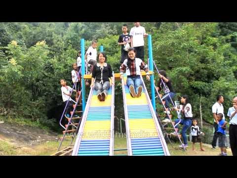 Children play with slider at Children's Park in Reiek Heritage Village - Mizoram