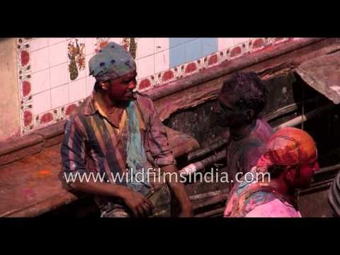 People are seen smeared in colours during Holi festival - Vrindavan