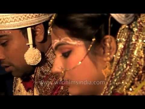 Hindu priest chants holy mantras: Bengali wedding