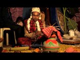 Groom performs wedding rituals: Bengali wedding