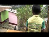 A boy rinsing his mouth after brushing - Assam