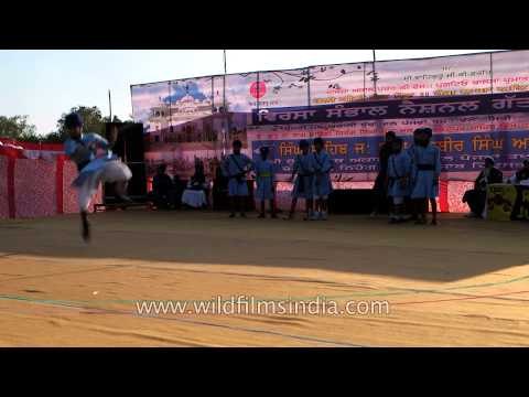 Young Nihangs demonstrate sword fight in Punjab