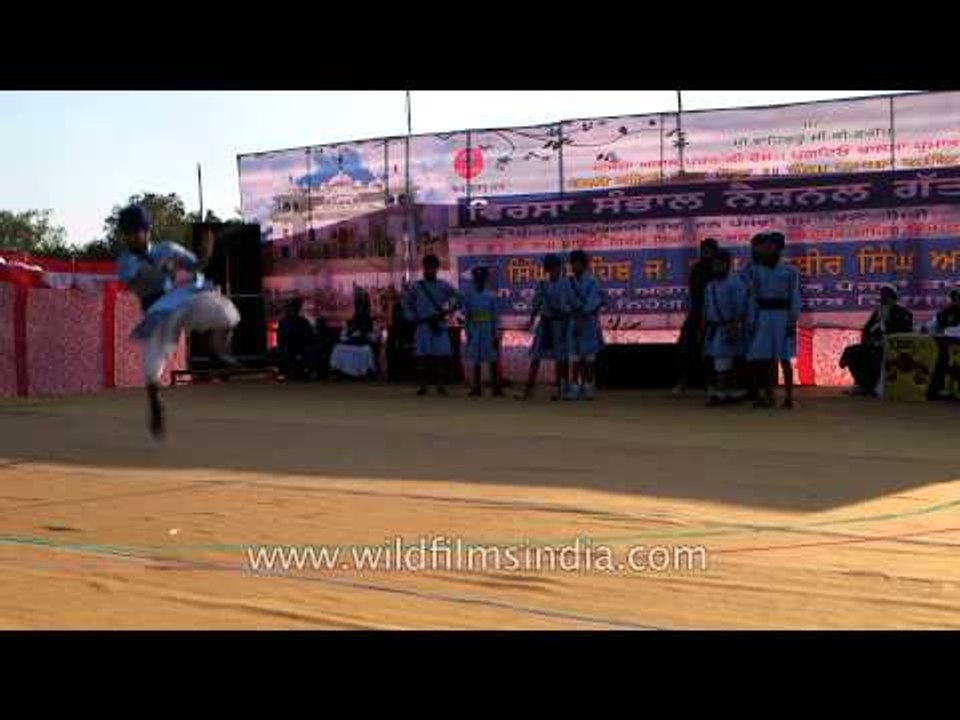 Young Nihangs demonstrate sword fight in Punjab