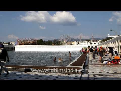 Indian Sikh devotees bathe in the holy sarover : Takht Sri Keshgarh Sahib, Punjab