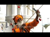 Old armed Sikh man shows us how he shoots arrows