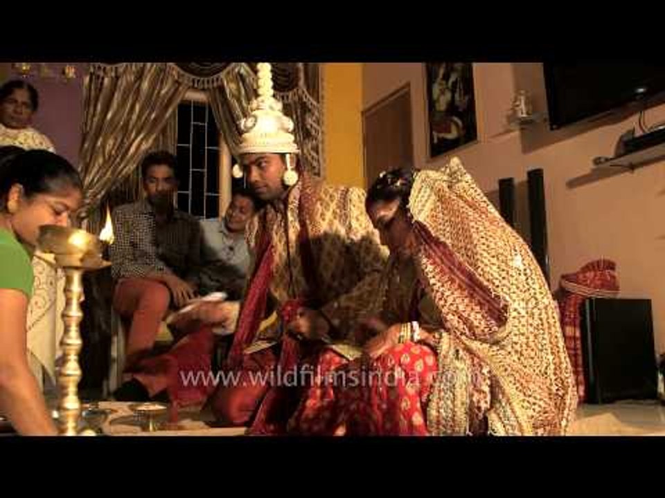 Relatives blessing the newly married couple