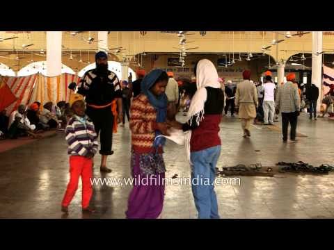 Pilgrims await for langar at Kesgarh Sahib Gurudwara, Punjab