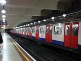 London underground train leaving Gloucester Road station