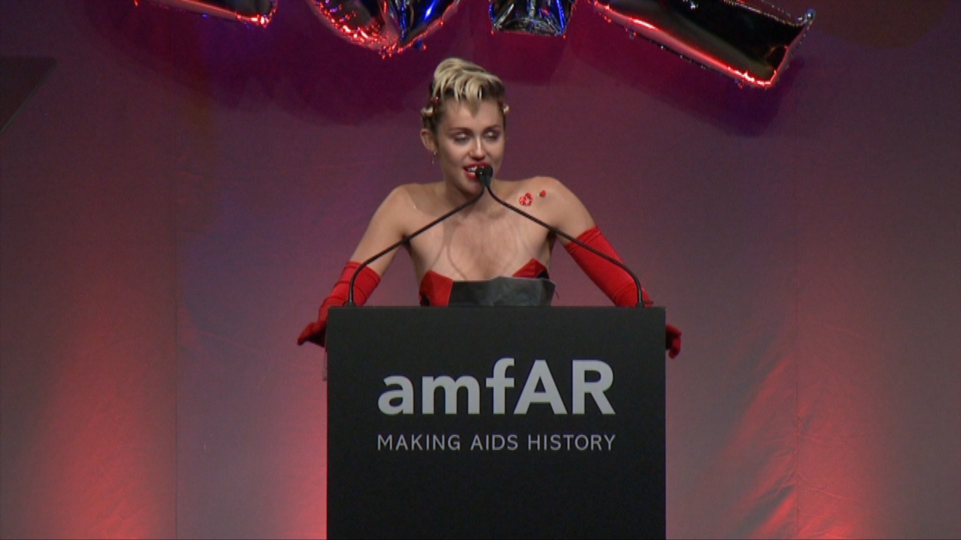Miley Cyrus Honored In Very Sexy Red Dress At amfAR Gala