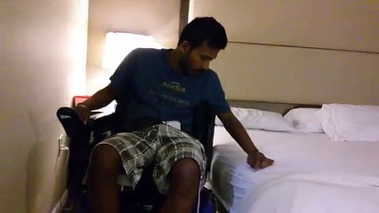 SCIVideoBlog.com - Quadriplegic Hotel Bed Transfer