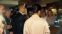 Slainte! Barack Obama toasts Irish ancestors with a Guinness